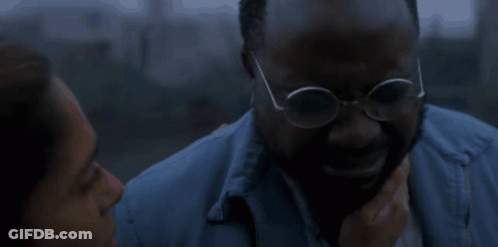 Man In Glasses Comforted By Woman In Blue Jacket GIF