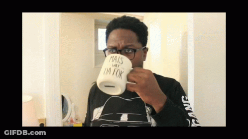 Man In Glasses Drinking From Mug Saying Mais Day I'm Ok GIF