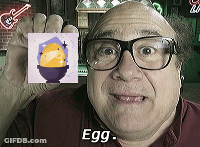 Man In Glasses Holding Picture Of Egg With Word Egg GIF