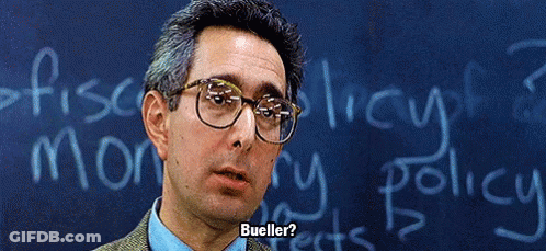 Man In Glasses In Front Of Chalkboard Saying Bueller GIF