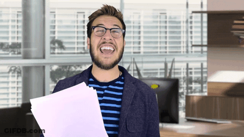 Man In Glasses Laughing Holding Paper GIF