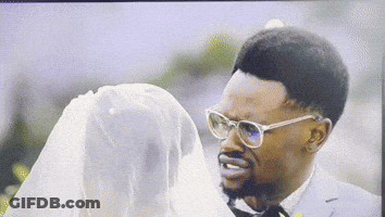 Man In Glasses Looking At Woman In White Dress GIF