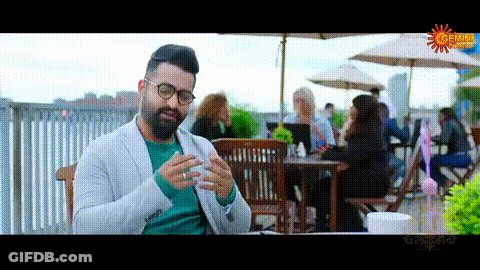 Man In Glasses Lying In Bed On Phone GIF