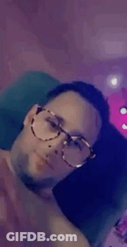 Man In Glasses On Couch Smiling GIF