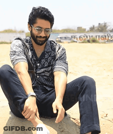 Man In Glasses On Rock With Tamil Sign GIF