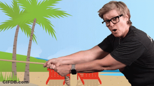 Man In Glasses Pulling Rope On Beach GIF