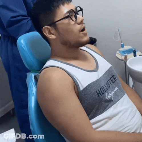 Man In Glasses Sitting In Dental Chair GIF