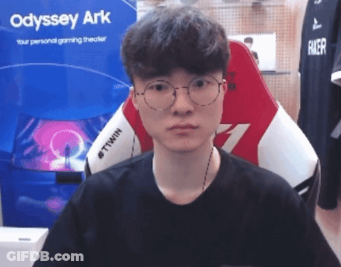 Man In Glasses Sitting In Front Of Odyssey Ark Sign GIF