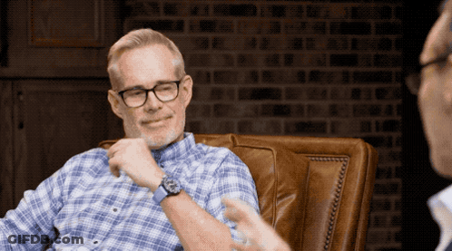 Man In Glasses Sitting With Another Man GIF