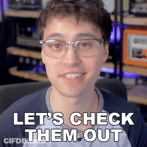 Man In Glasses Smiling Saying Lets Check Them Out GIF