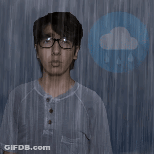 Man In Glasses Standing In Rain GIF
