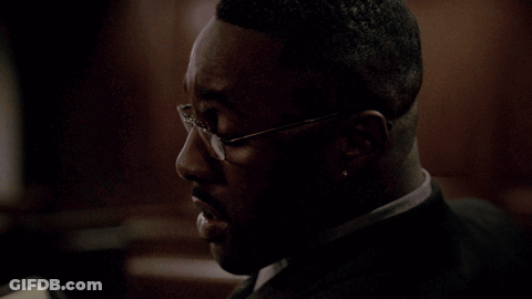 Man In Glasses Talking To Woman In Living Room GIF