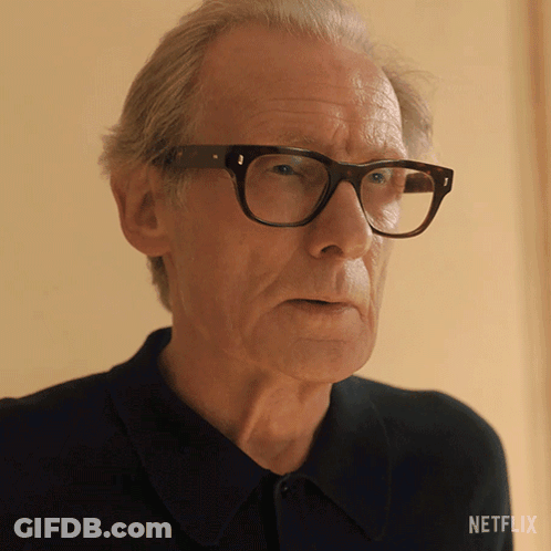 Man In Glasses With Netflix Logo GIF