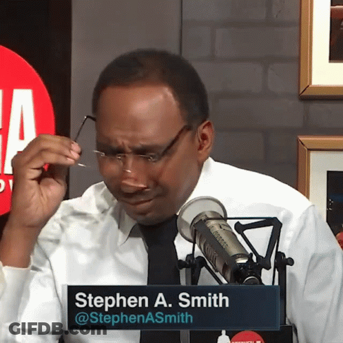 Man In Glasses With Stephen A. Smith Name Tag At Microphone GIF