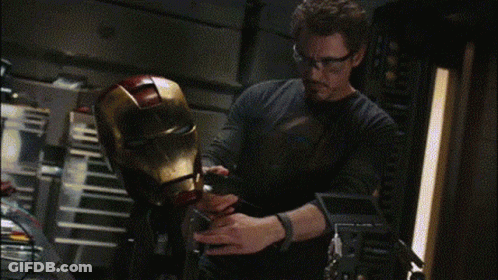 Man In Glasses Working On Iron Man Helmet GIF