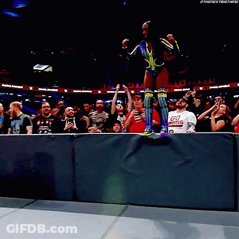 Man In Go Power Shirt In Front Of Crowd GIF