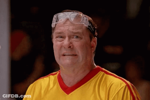 Man In Goggles And Yellow Striped Shirt Making Face GIF