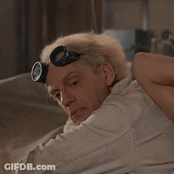 Man In Goggles Looking Over Shoulder GIF
