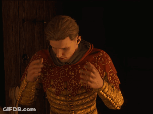 Man In Gold And Red Embroidered Jacket Holding Head GIF