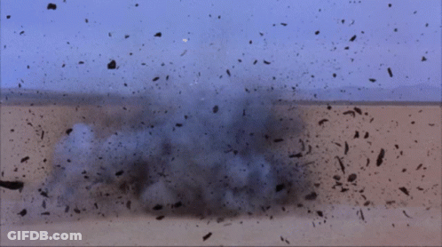 Man In Gold Helmet In Desert GIF