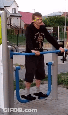Man In Gold S Gym Shirt Exercising On Machine GIF