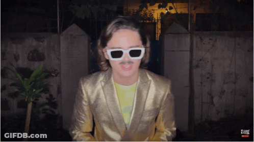 Man In Gold Suit And White Sunglasses GIF