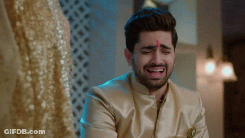 Man In Gold Suit Crying Watching Woman In Gold Dress GIF