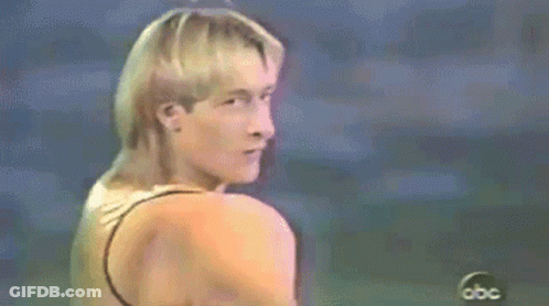 Man In Gold Tank Top In Front Of ABC Logo GIF