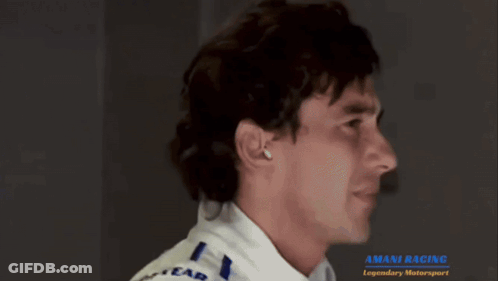 Man In Goodyear Jacket Looking To The Side GIF