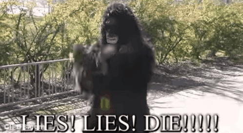 Man In Gorilla Costume Holding Gun Saying Lies Lies Die GIF