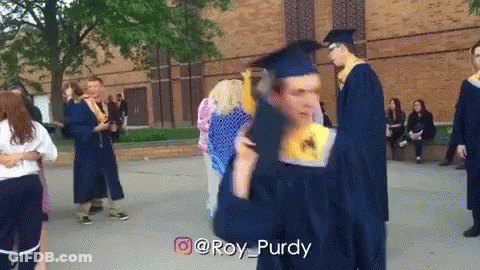 Man In Graduation Cap And Gown Holding Diploma GIF