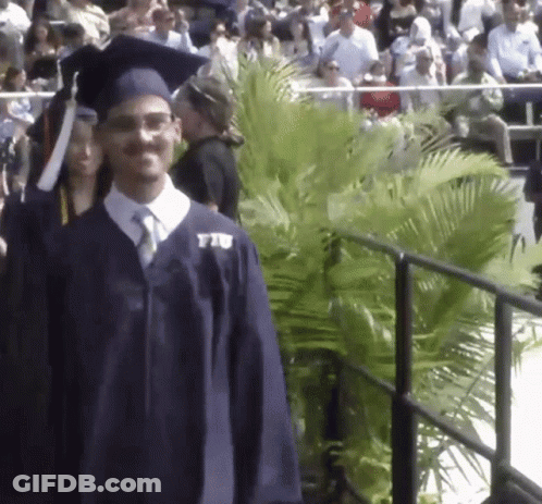Man In Graduation Cap And Gown With FIU Shirt GIF