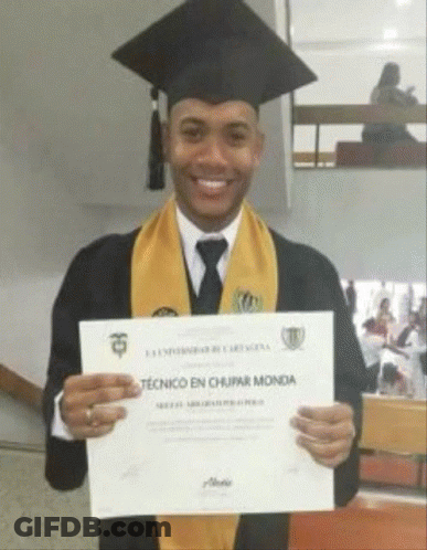 Man In Graduation Gown Holding Certificate Saying Tecnico En Chupar Mondia GIF