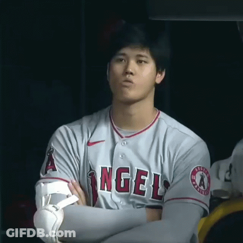 Man In Gray Angels Jersey With Arms Crossed GIF