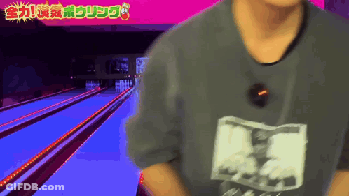 Man In Gray Shirt At Bowling Alley GIF