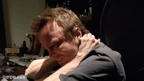 Man In Gray Shirt Held By Another Man's Hand GIF