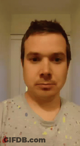 Man In Gray Shirt Making Funny Face GIF