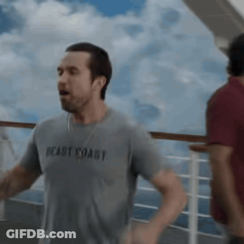 Man In Gray Shirt Saying Beast Coast Running On Cruise Ship GIF