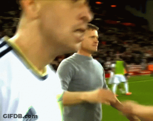 Man In Gray Shirt Shakes Hands With Man In White Shirt GIF