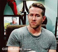 Man In Gray Shirt Sitting Saying Great GIF