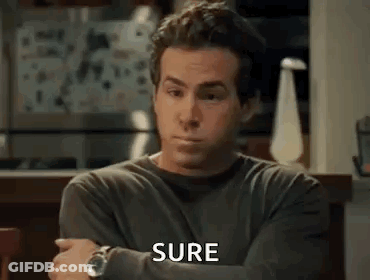 Man In Gray Shirt Sitting With Arms Crossed Saying Sure GIF