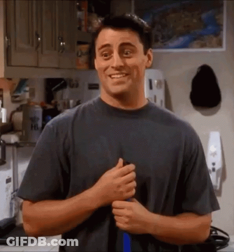 Man In Gray Shirt Smiling In Kitchen GIF