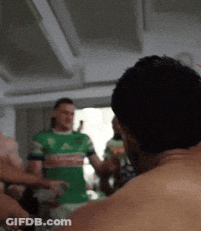 Man In Green Adidas Shirt Standing GIF
