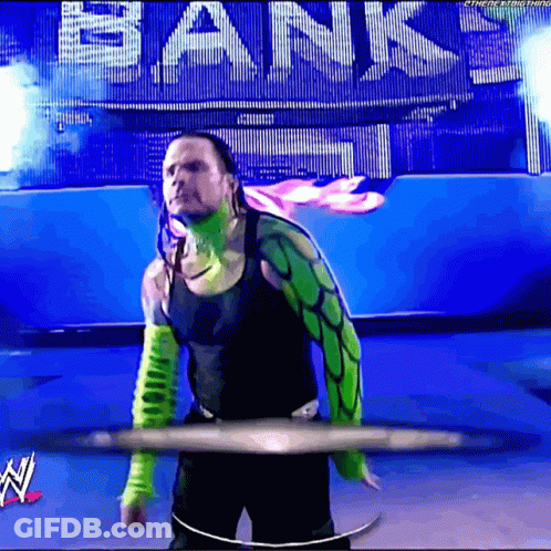 Man In Green And Black Outfit Standing In Front Of Bank Sign GIF