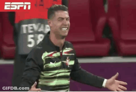 Man In Green And Black Shirt Laughing In Stadium GIF