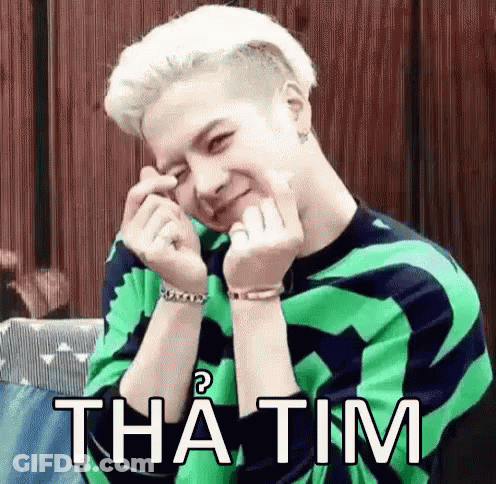 Man In Green And Black Sweater Making Heart With Hands GIF