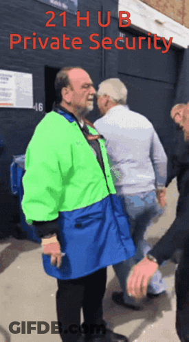 Man In Green And Blue Jacket Escorted By Security Guard GIF