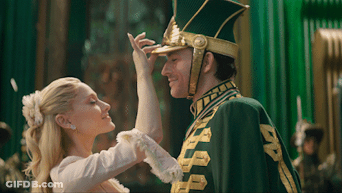 Man In Green And Gold Uniform Dancing With Lady GIF