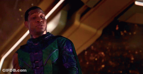Man In Green And Purple Superhero Costume GIF