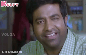Man In Green And White Checkered Shirt Smiling GIF